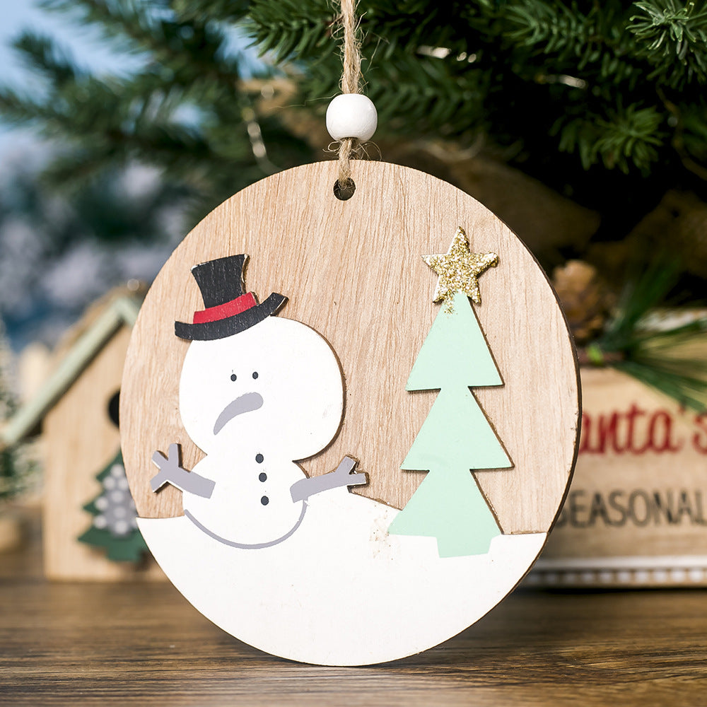 Hand-painted wooden Christmas pendant with elk design displayed against festive background