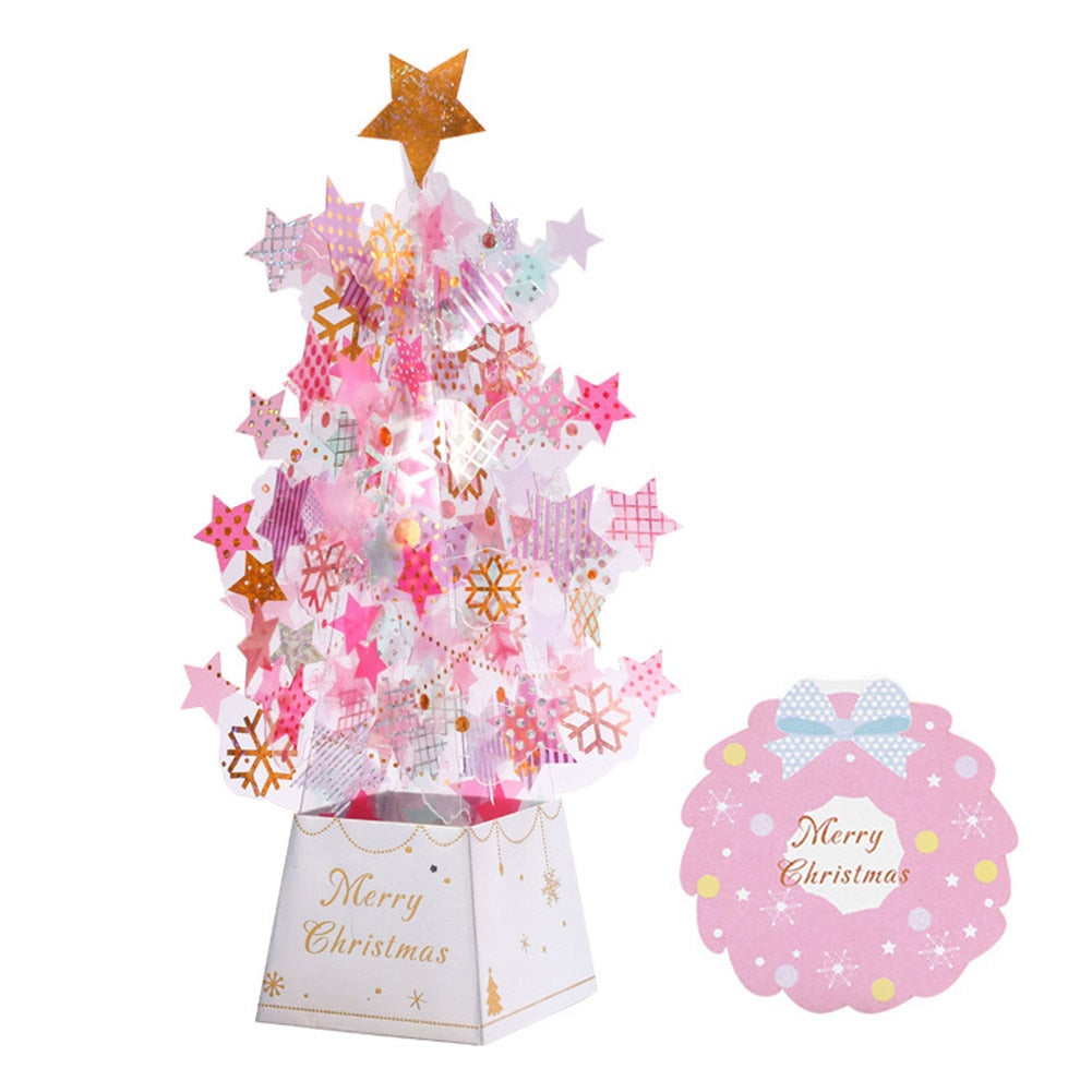 3D pop-up Christmas tree card opened to reveal sculptural tree with snowflake sequins