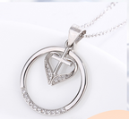 Elegant Jesus cross pendant with heart motif in polished silver finish