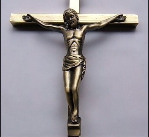 Close-up view of intricate crucifix design with religious symbolism - Devotional Necklace