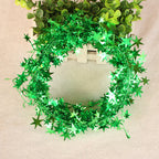 Festive pine garland with hanging stars for Christmas tree decoration