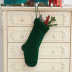 Green Christmas stocking with red accents for traditional holiday decorating