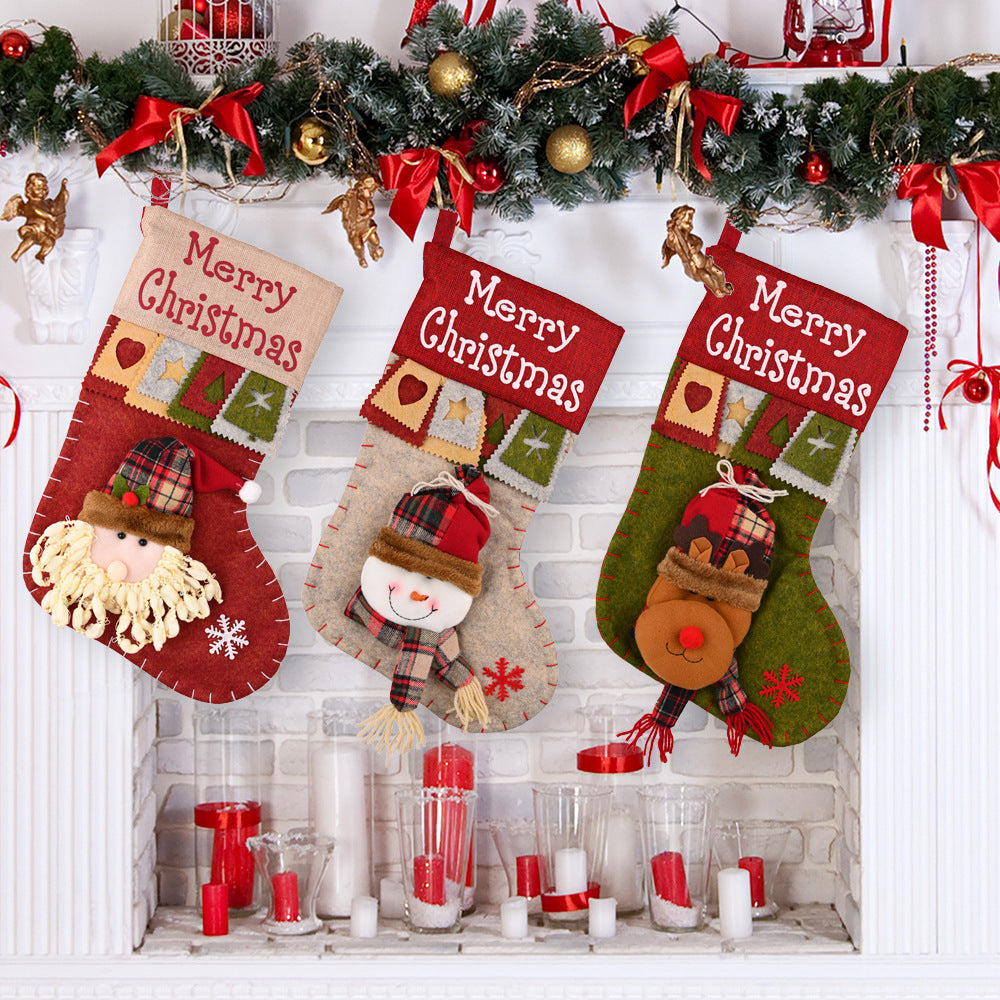 Colorful Christmas decorative pendant on textured fabric surface
