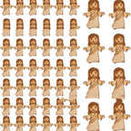 Close-up of miniature wooden figures crafted from boxwood for nativity displays