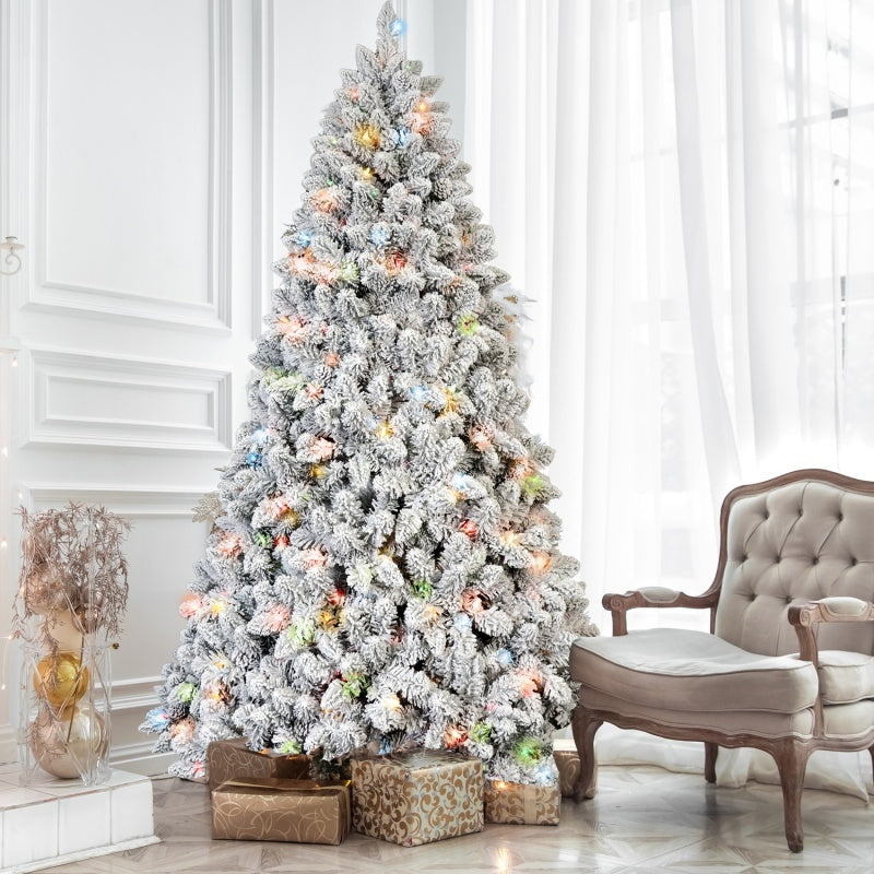 Christmas tree decorated with pine cones and glowing colored lights at night