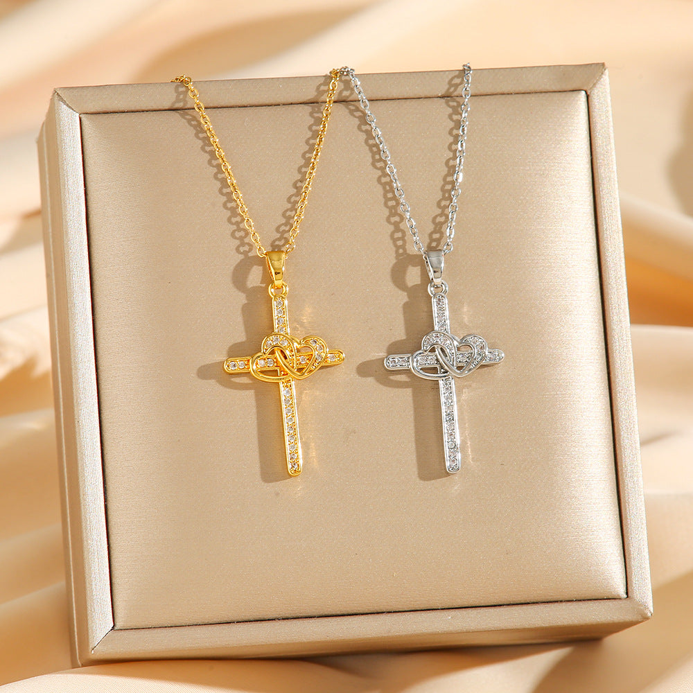 Cross pendant necklace displayed on a dark background
