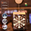 Warm white LED pendant light with Christmas cross design glowing softly against a dark background
