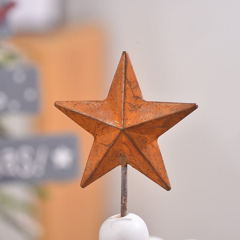 Holiday wooden ornaments showing white and green color scheme