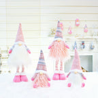 Holiday decoration arrangement with multiple doll styles
