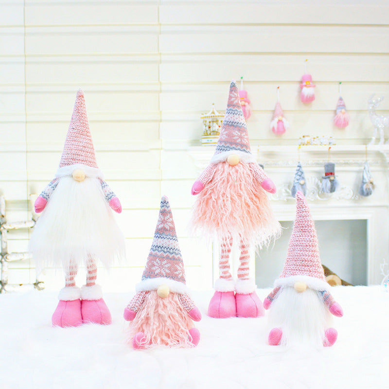 Holiday decoration arrangement with multiple doll styles
