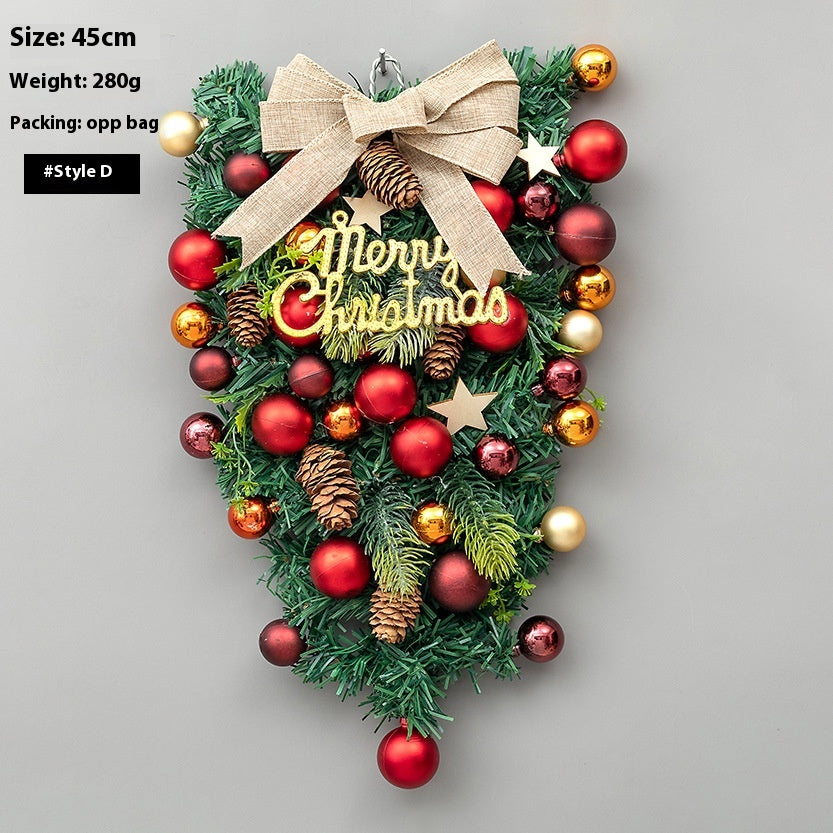 Inverted green Christmas tree with horn ornament accents