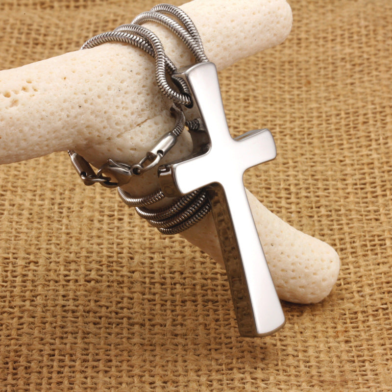 Close-up of glossy cross pendant craftsmanship