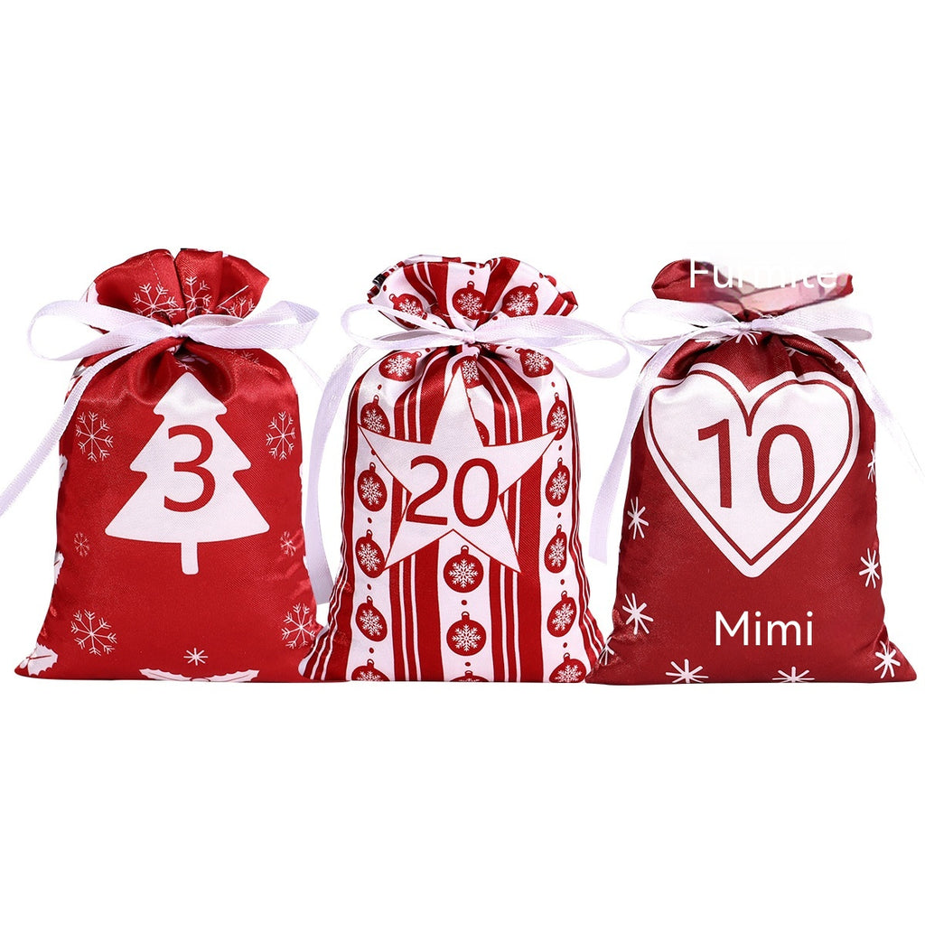 Advent calendar gift bag set laid out showing all 24 bags with clips and ribbon