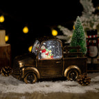 Christmas crystal ball ornament with music on festive display