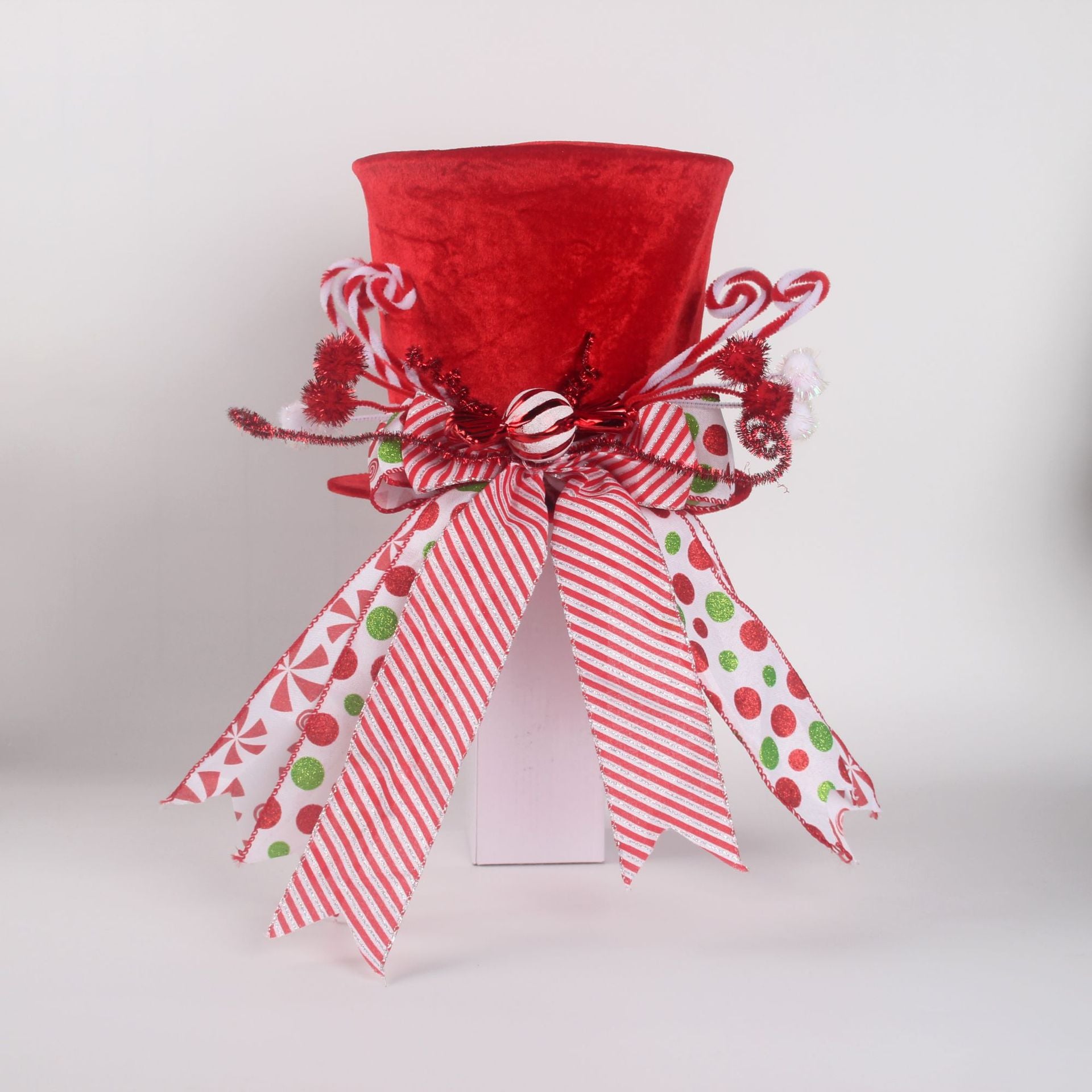 Festive magician hat Christmas tree topper with playful holiday design