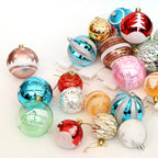 Christmas ball ornaments displayed on decorated holiday tree branch
