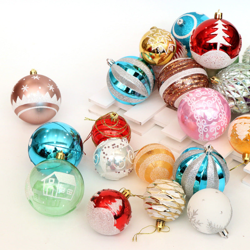Christmas ball ornaments displayed on decorated holiday tree branch