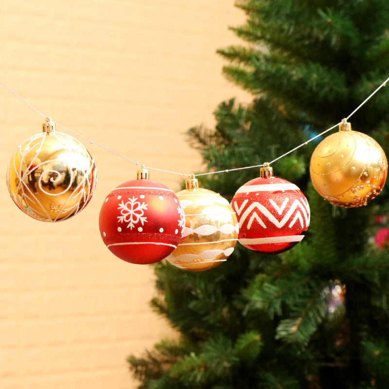 Hand-painted Christmas ball ornament in festive colors on dark background