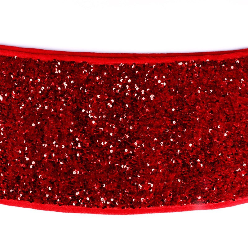 Red sequin Christmas tree skirt showing full circumference in holiday setting