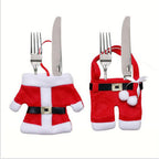 Christmas dinner table setting with decorative napkin holders