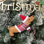 Close-up of dressed sausage dog pendant in warm brown non-woven fabric for Christmas