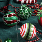 Set of colorful electroplated Christmas tree ornaments hanging in festive display