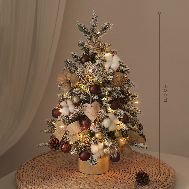 Close-up of PE Christmas tree branches with twinkling integrated lights