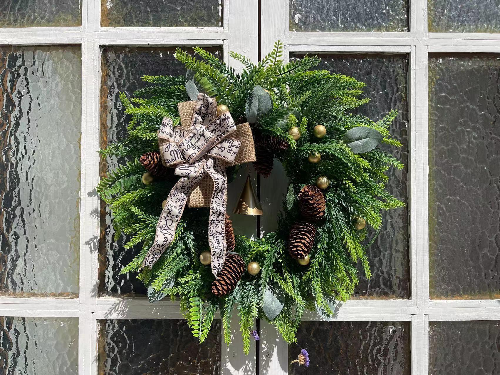 Traditional Christmas wreath with pine cones for seasonal front door display