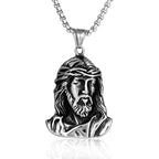 Close-up of sculpted Jesus pendant on steel chain