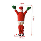 Santa Claus climbing a wall in a festive Christmas scene with holiday charm