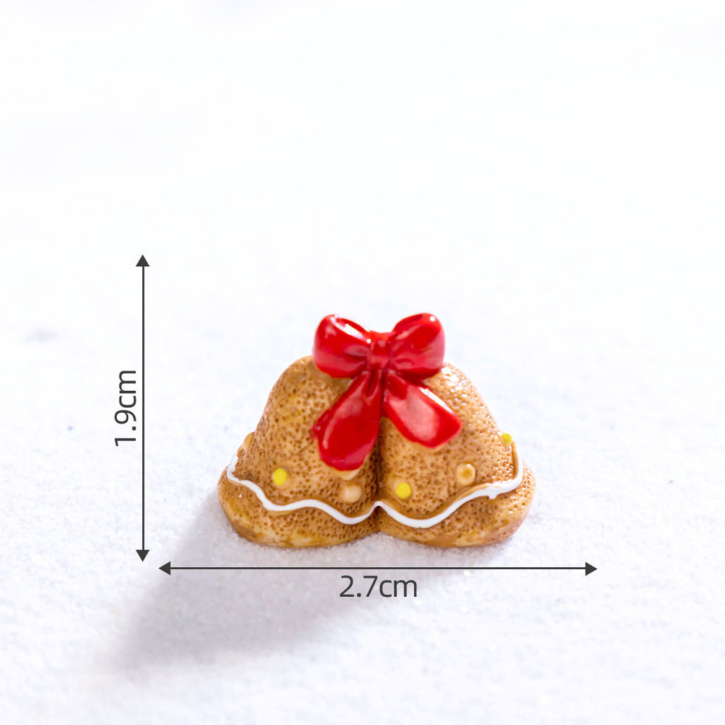 Colorful resin gingerbread man ornament displayed on a decorated Christmas tree