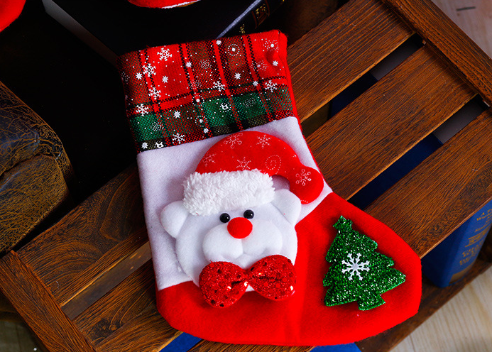 Christmas sock ornaments in winter wonderland themed setting