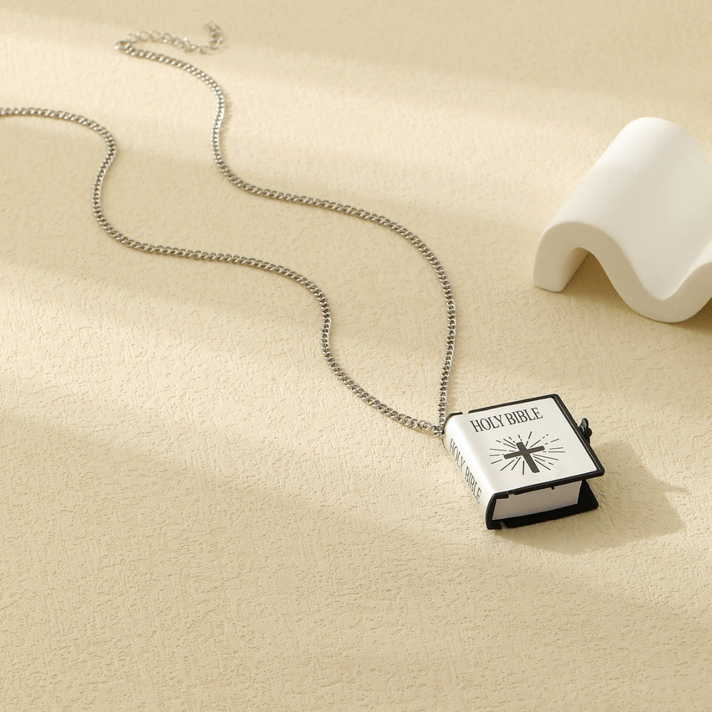 Gold cross Bible verse pendant necklace close up