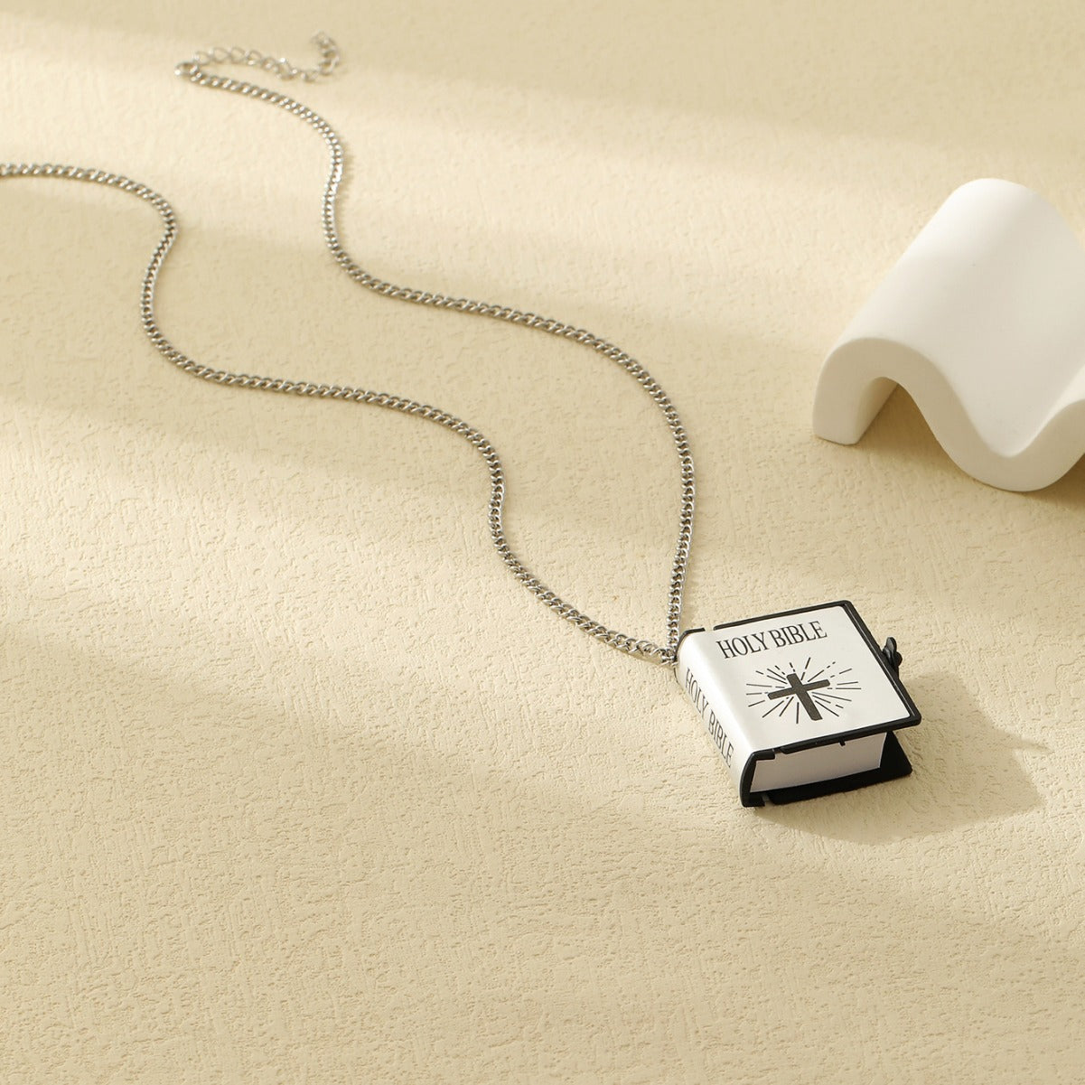 Gold cross Bible verse pendant necklace close up