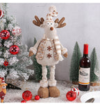 Holiday window decoration featuring woodland Christmas scene with snowman