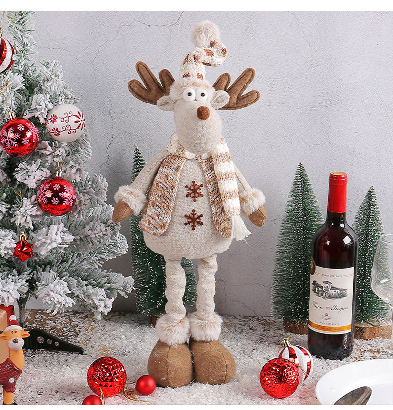 Holiday window decoration featuring woodland Christmas scene with snowman