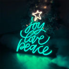 Christmas tree neon sign displayed on wall with warm festive lighting