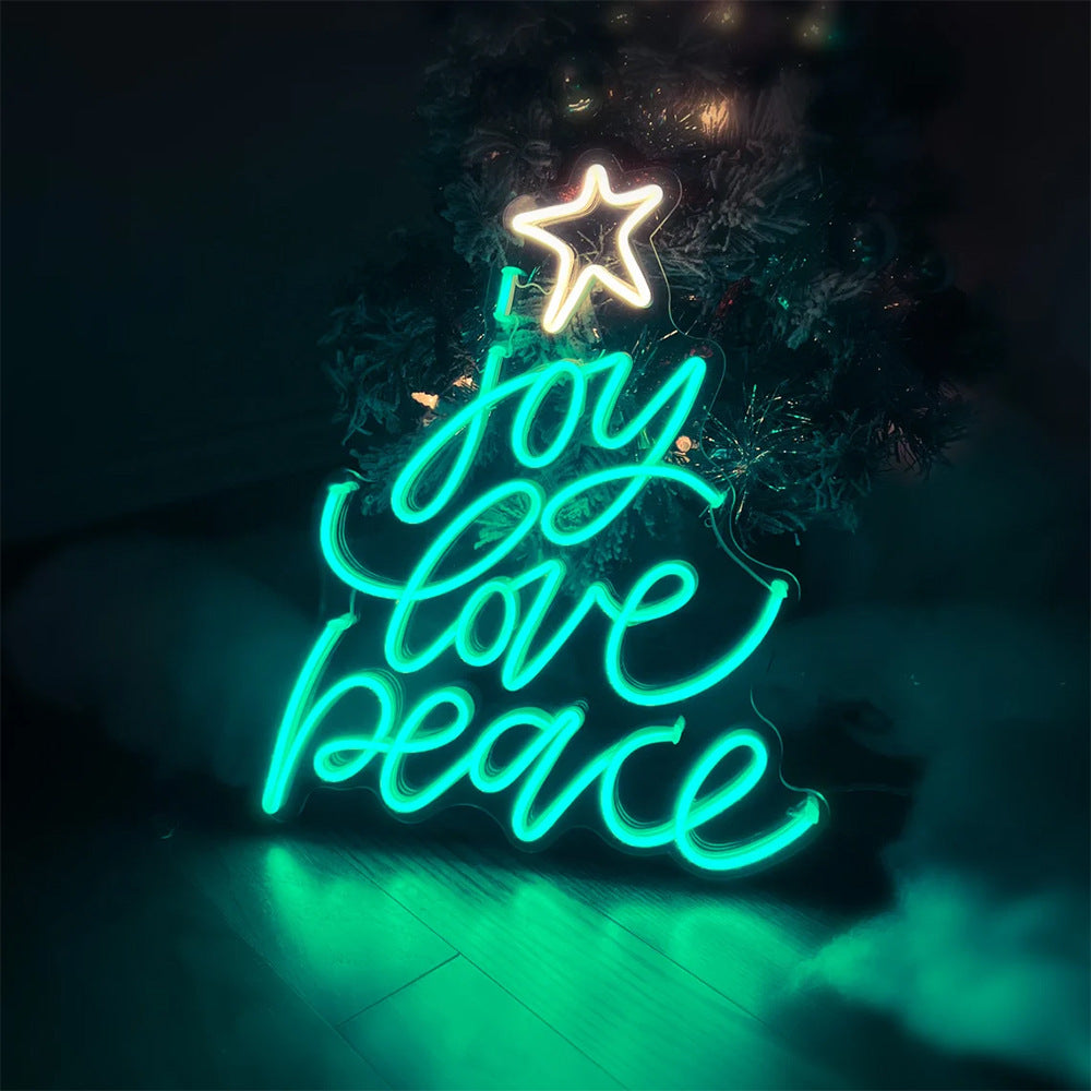 Christmas tree neon sign displayed on wall with warm festive lighting