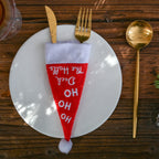 Cozy Christmas table scene with decorative hat and utensils