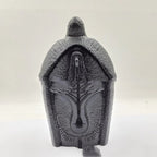 Stack of multiple resin Jesus ornaments showing collection variety for retail display