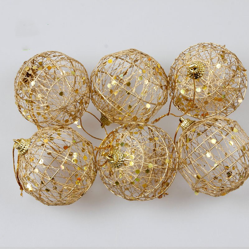Gold-tone scaly Christmas ball ornament displayed prominently for faith-based holiday gifting Main image