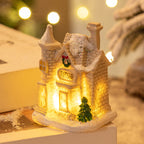 Resin Christmas house decoration displayed on festive surface