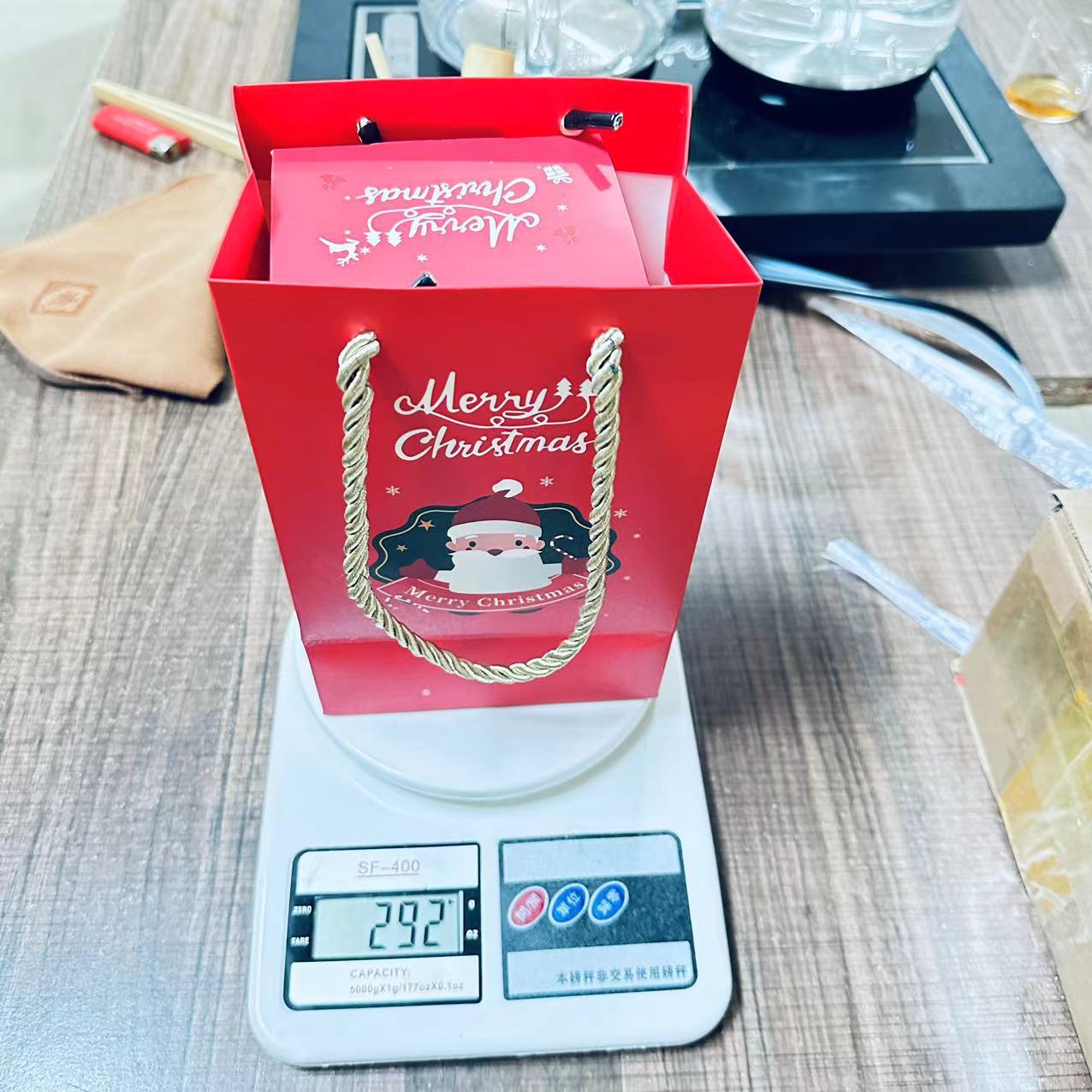 Paper Christmas bounce boxes displayed on festive holiday background