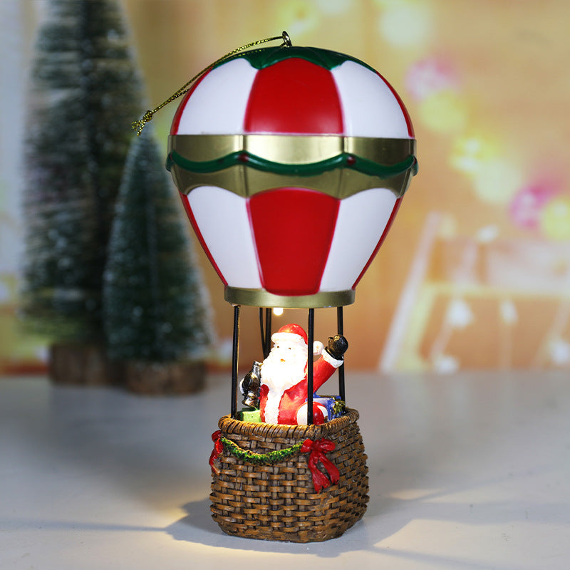 Luminous snowman Christmas ornament on a decorated tree in warm ambient light