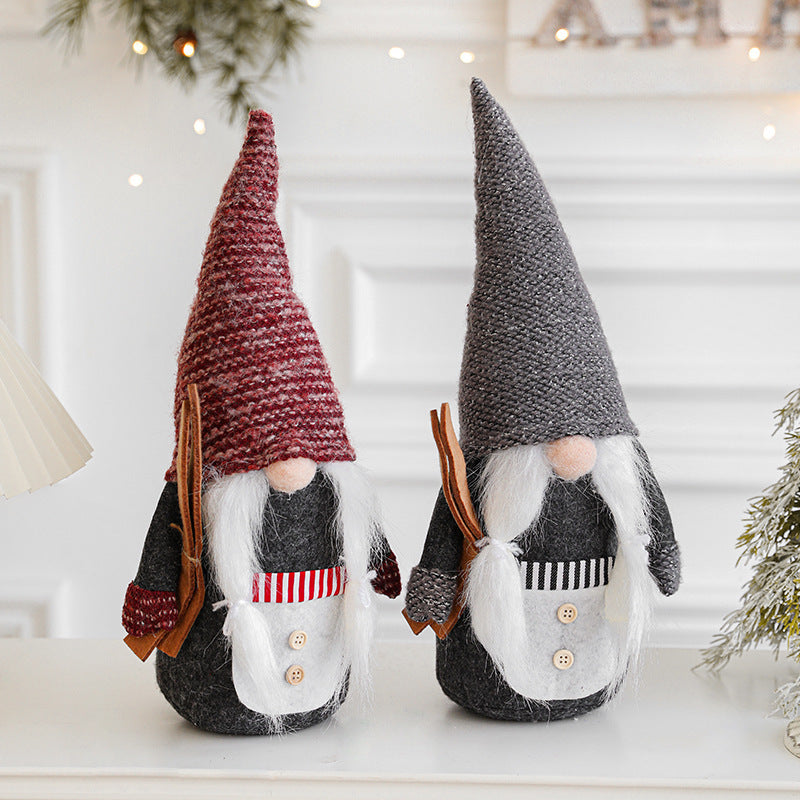 Christmas Rudolf ornament with gray clothes displayed against a festive background