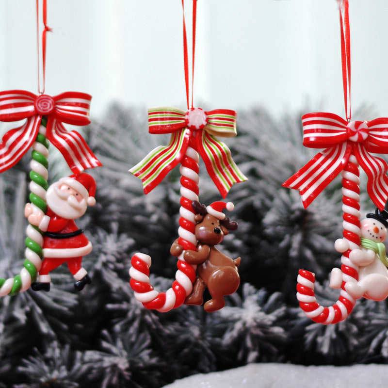 Set of three Christmas ornaments featuring Santa, snowman and deer designs