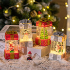 Set of colorful Christmas light-up gift box decorations on display