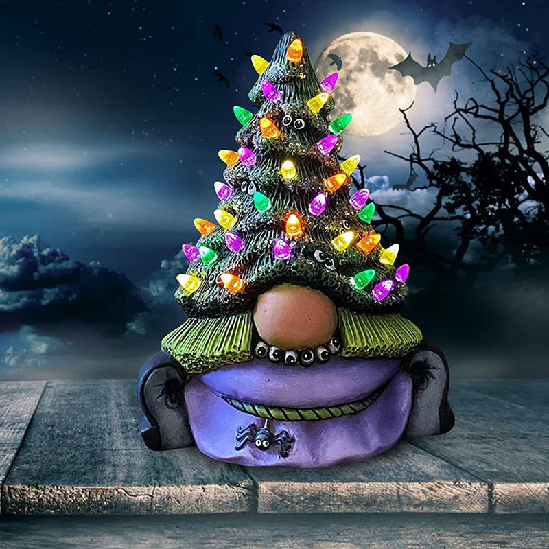 Lighted cartoon Christmas tree resin sculpture ornament in festive holiday setting