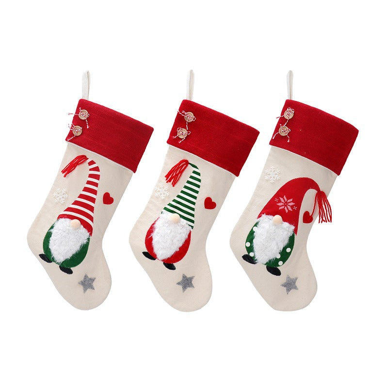 Set of three Nordic Christmas gift bags with sock-stocking style design