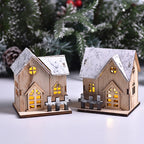 Glowing wooden Christmas house on wooden surface